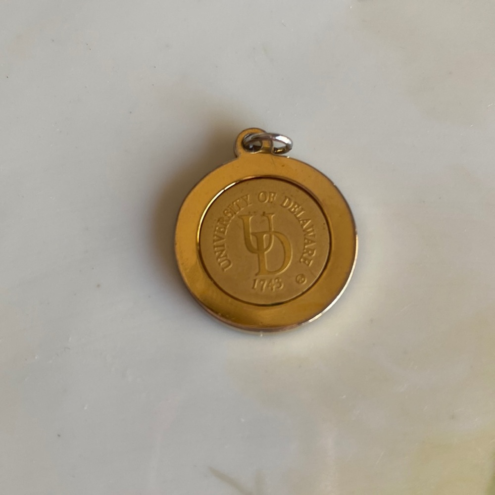 University of Delaware gold pendant